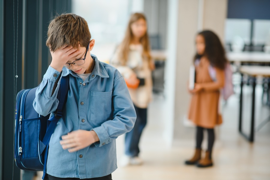 bullied kid at school, symptoms to watch out for.