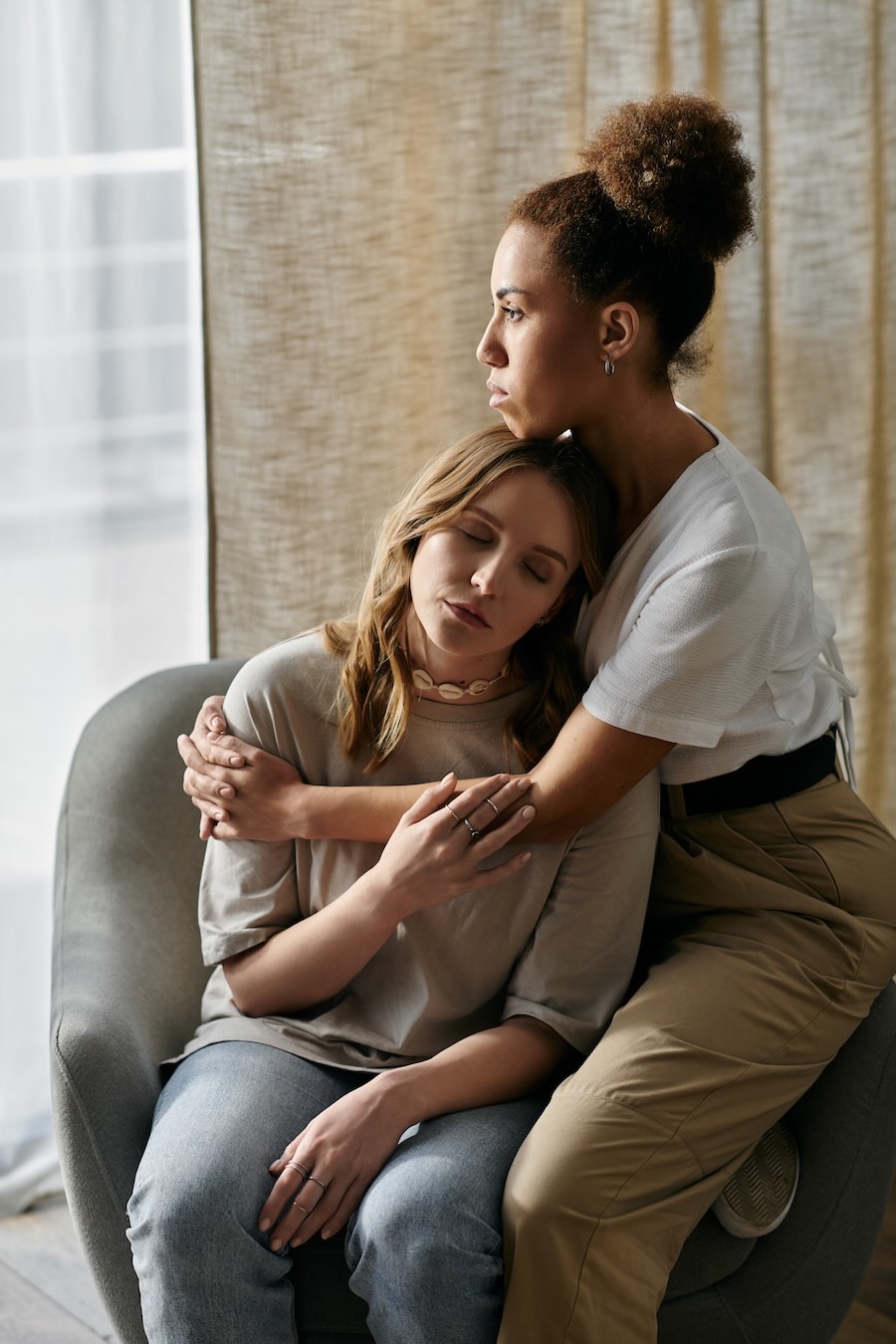 one woman supporting another